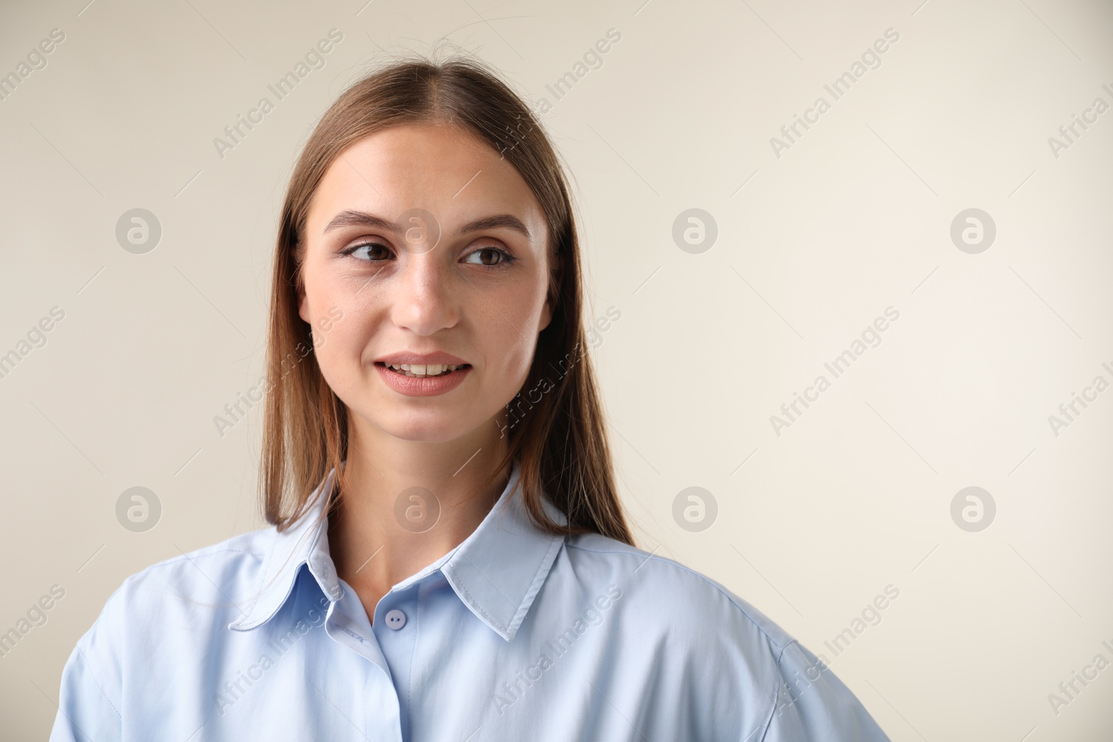 Photo of Portrait of beautiful woman on light background. Space for text