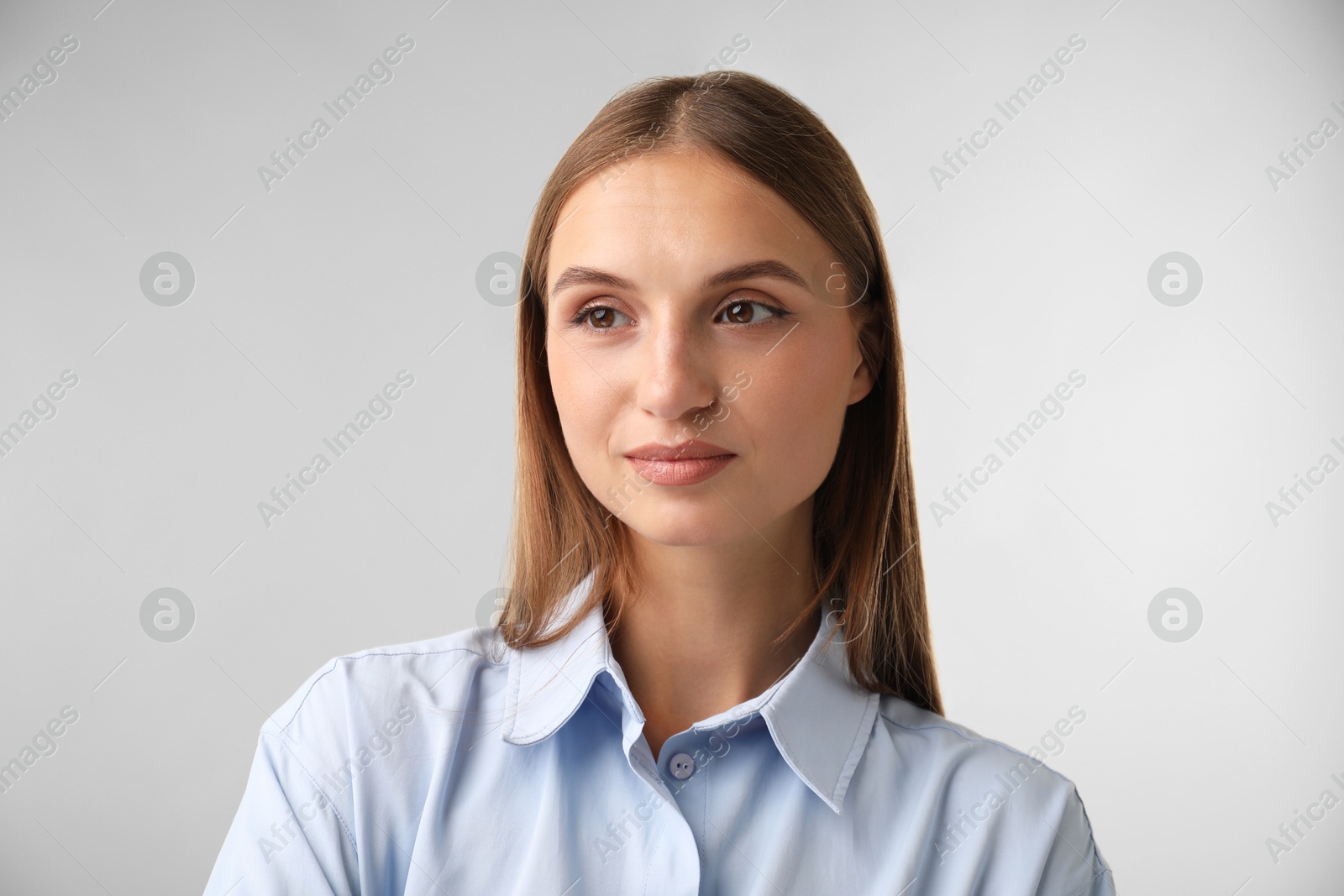 Photo of Portrait of beautiful woman on light background