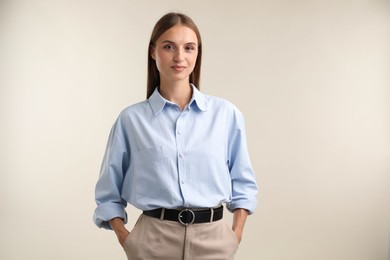 Photo of Portrait of beautiful woman on light background