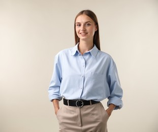 Photo of Portrait of beautiful woman on light background