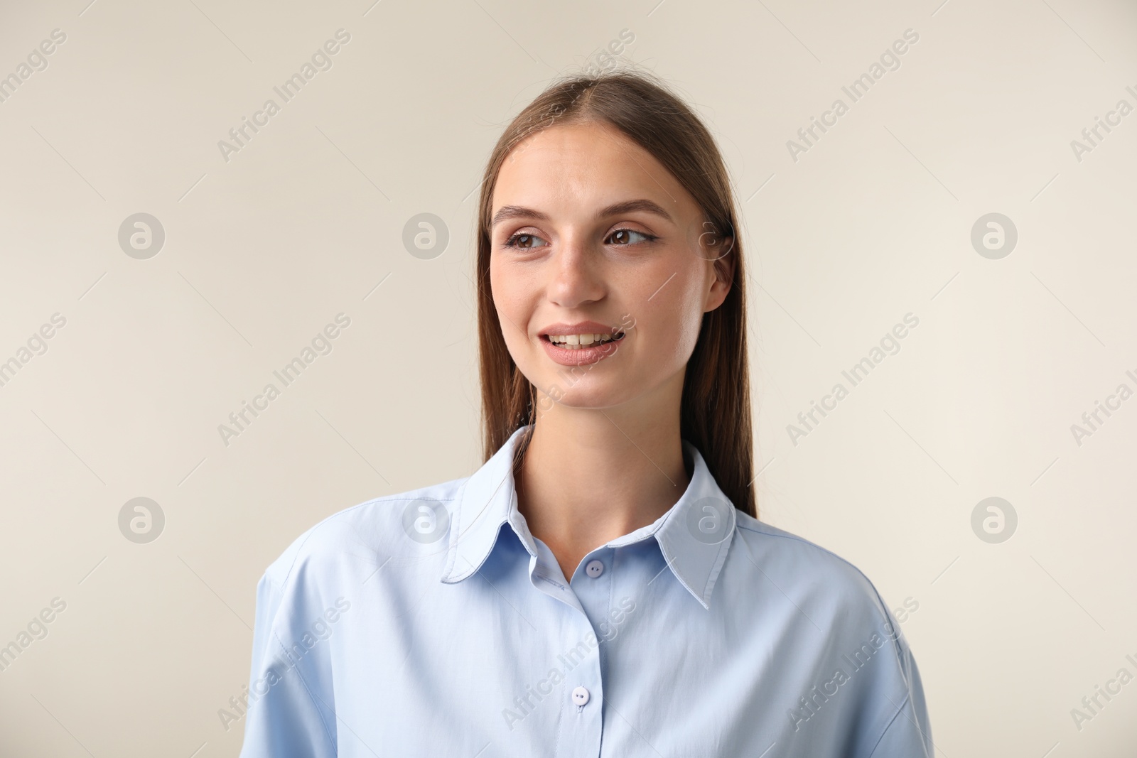 Photo of Portrait of beautiful woman on light background