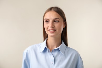 Photo of Portrait of beautiful woman on light background
