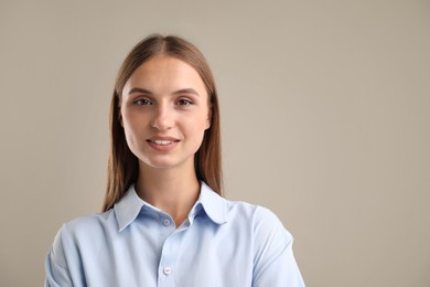 Photo of Portrait of beautiful woman on light background. Space for text