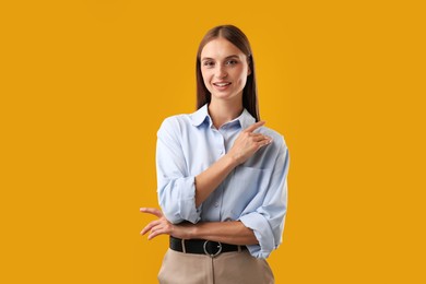 Photo of Portrait of beautiful woman on yellow background