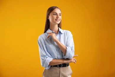 Photo of Portrait of beautiful woman on yellow background