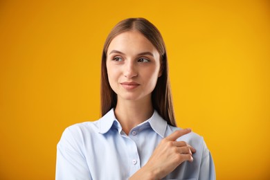 Photo of Portrait of beautiful woman on yellow background