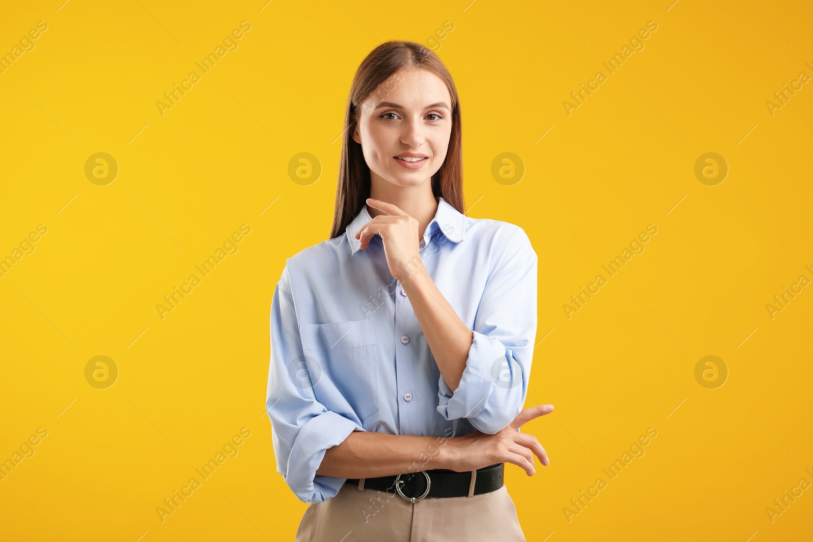 Photo of Portrait of beautiful woman on yellow background