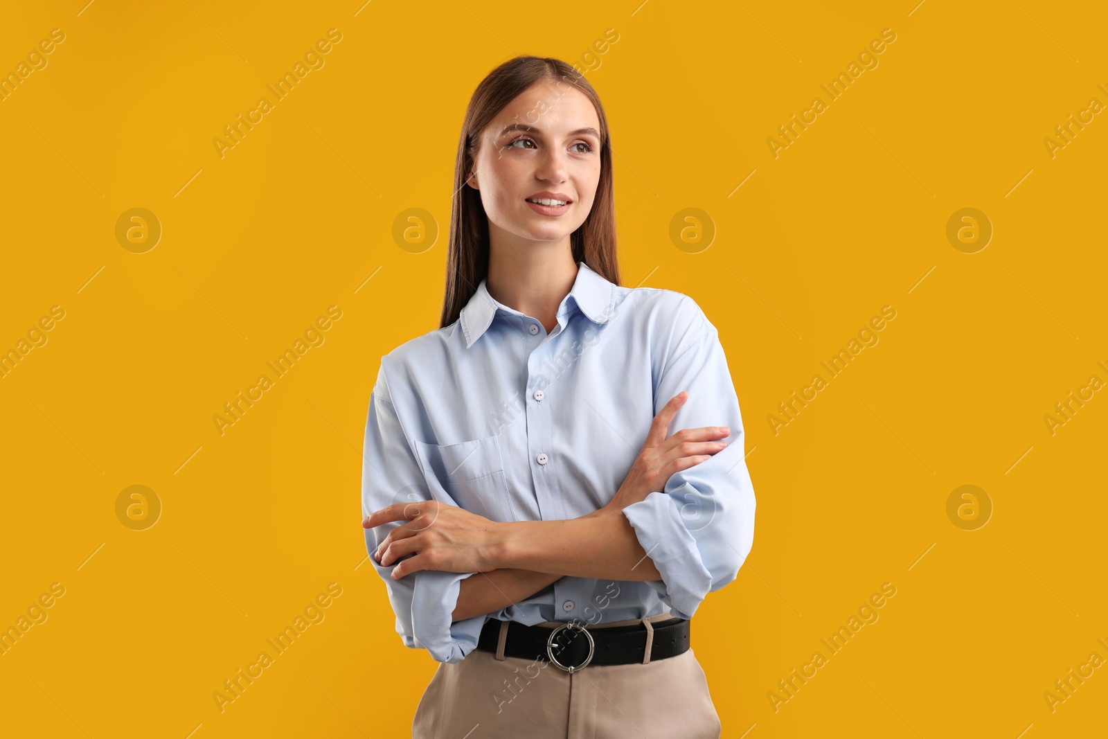 Photo of Portrait of beautiful woman on yellow background