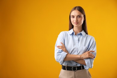 Photo of Portrait of beautiful woman on yellow background. Space for text