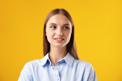 Photo of Portrait of beautiful woman on yellow background