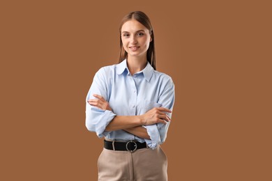 Photo of Portrait of beautiful woman on brown background