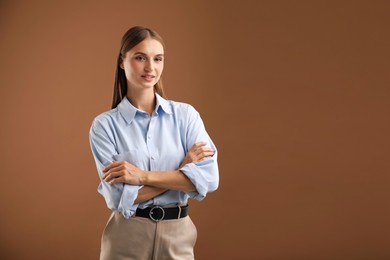 Photo of Portrait of beautiful woman on brown background. Space for text