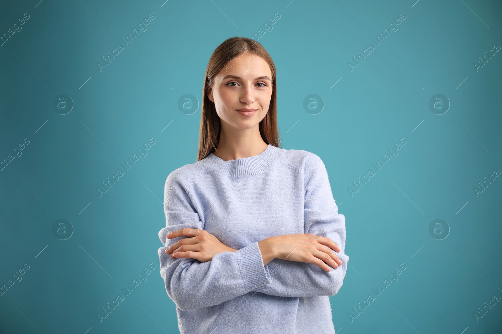 Photo of Portrait of beautiful woman on blue background