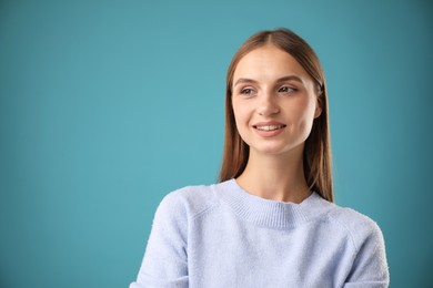 Photo of Portrait of beautiful woman on blue background. Space for text