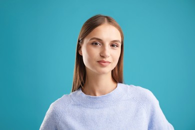 Photo of Portrait of beautiful woman on blue background