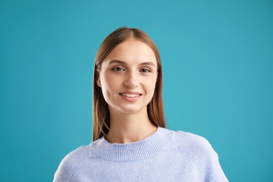Photo of Portrait of beautiful woman on blue background