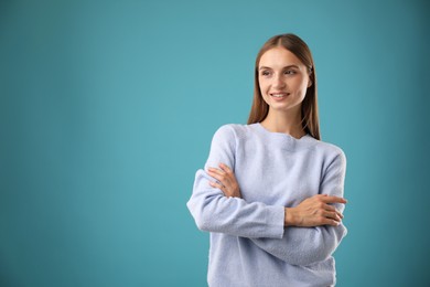 Photo of Portrait of beautiful woman on blue background. Space for text