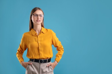 Photo of Portrait of confident woman on blue background. Space for text