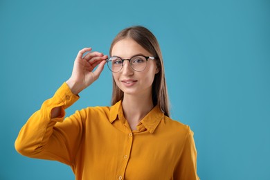 Photo of Portrait of confident woman on blue background