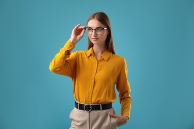 Photo of Portrait of confident woman on blue background