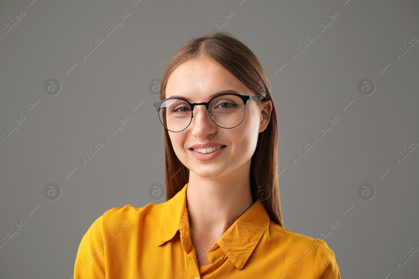 Photo of Portrait of confident woman on grey background