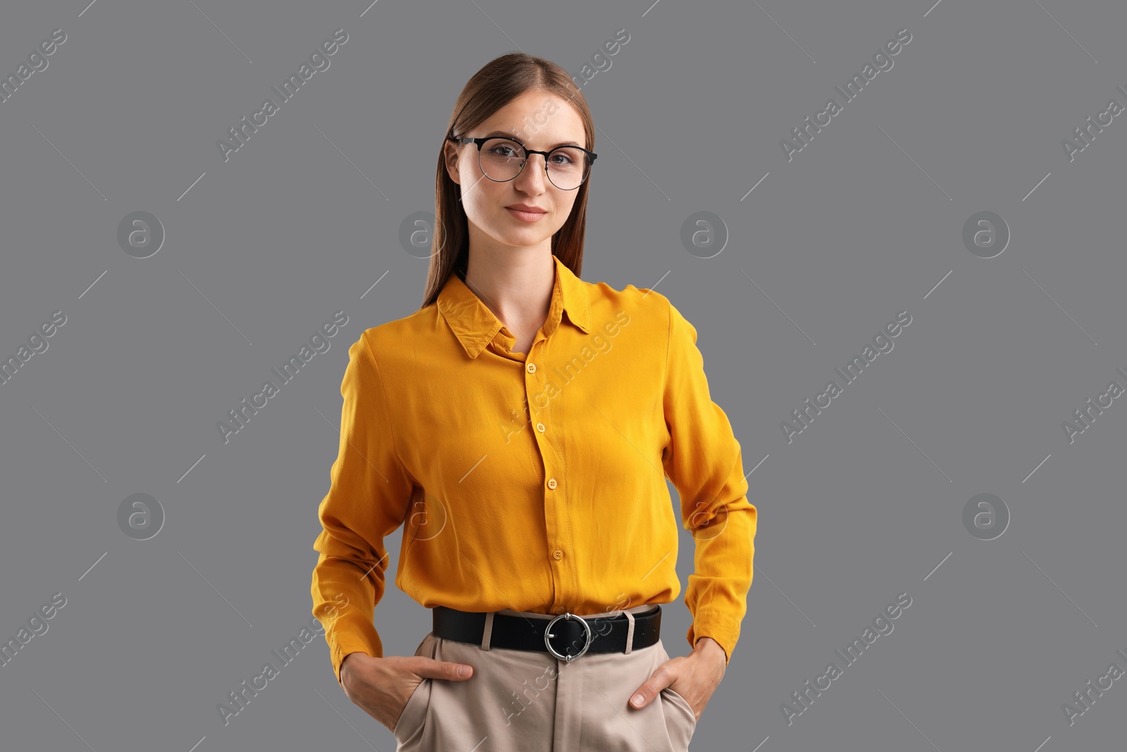 Photo of Portrait of confident woman on grey background