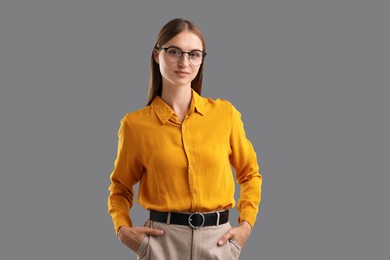 Photo of Portrait of confident woman on grey background