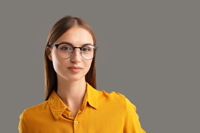 Photo of Portrait of confident woman on grey background. Space for text