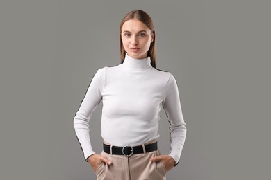 Photo of Portrait of confident woman on grey background