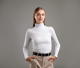 Photo of Portrait of confident woman on grey background