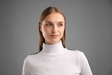 Photo of Portrait of confident woman on grey background