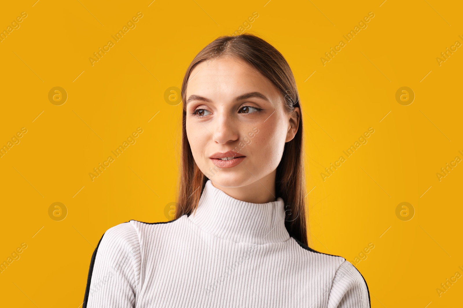 Photo of Portrait of confident woman on yellow background