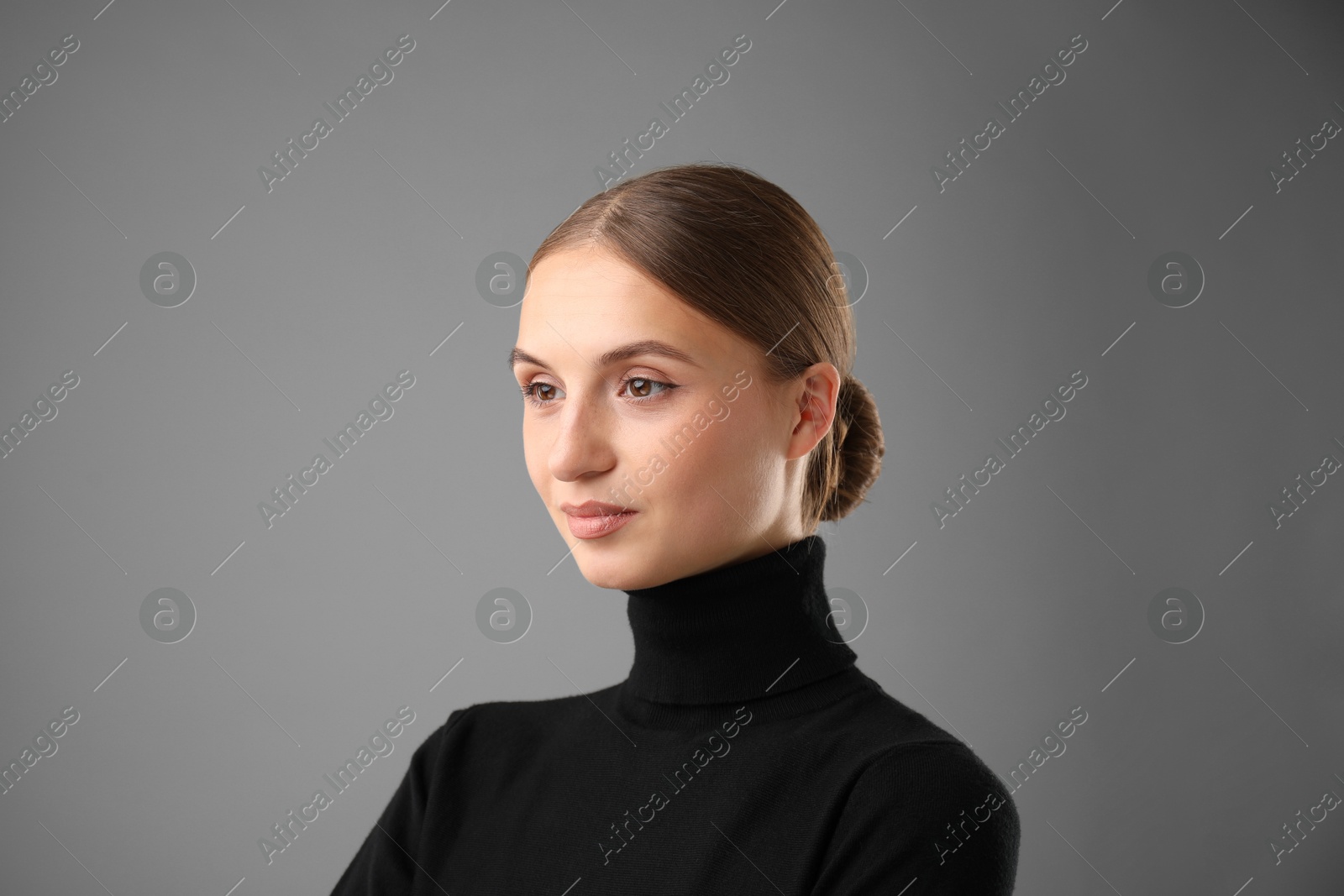 Photo of Portrait of confident woman on grey background