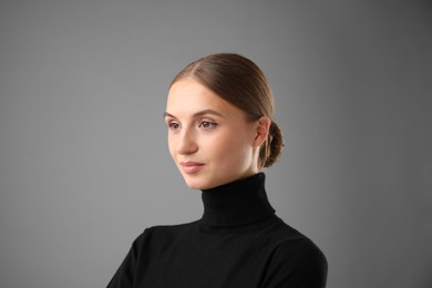 Photo of Portrait of confident woman on grey background