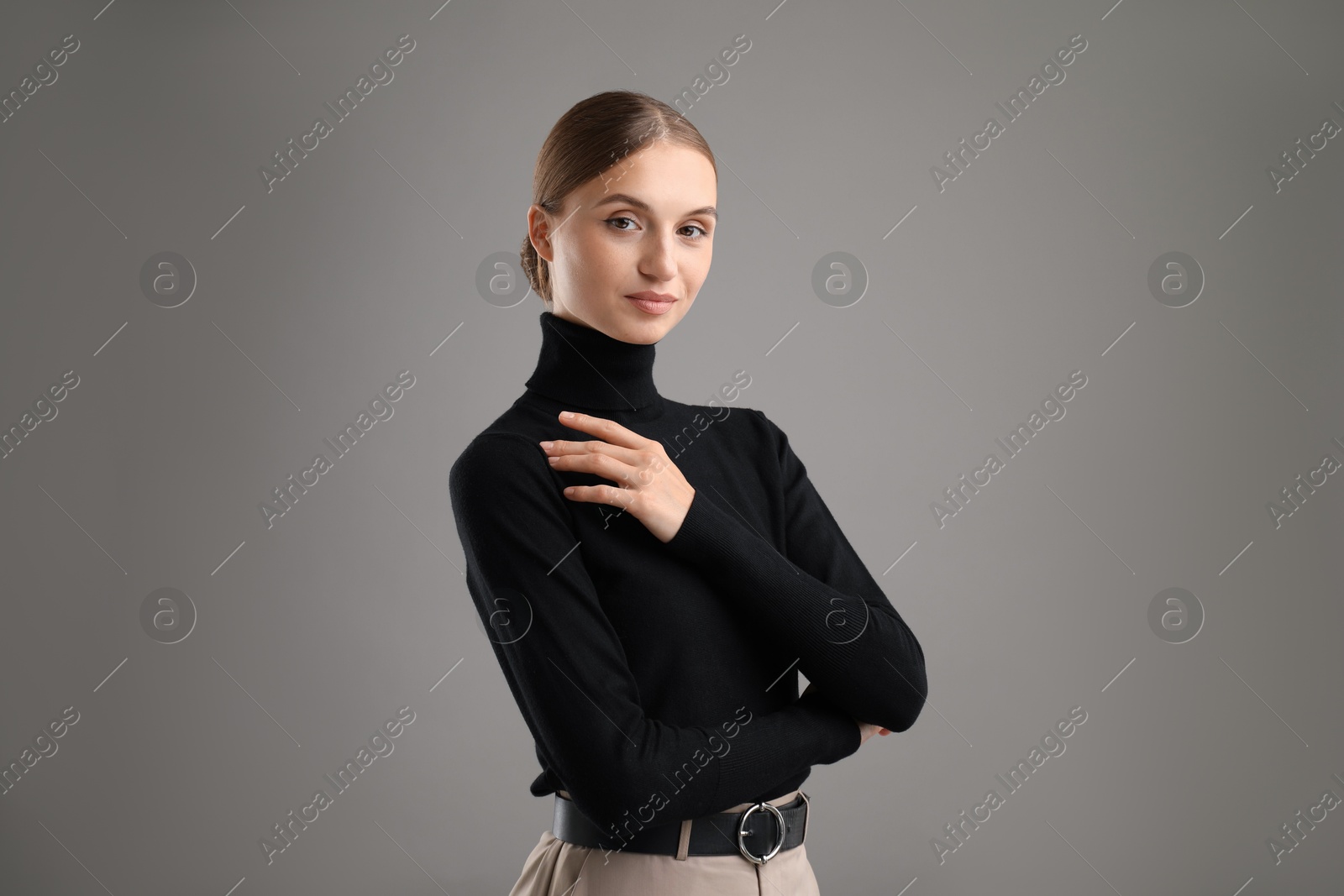 Photo of Portrait of confident woman on grey background