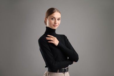 Photo of Portrait of confident woman on grey background