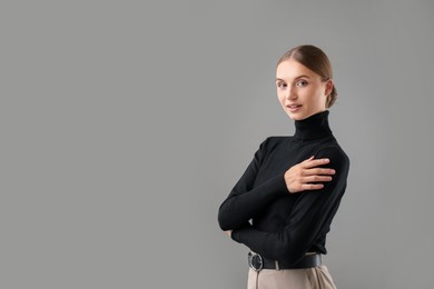 Photo of Portrait of confident woman on grey background. Space for text