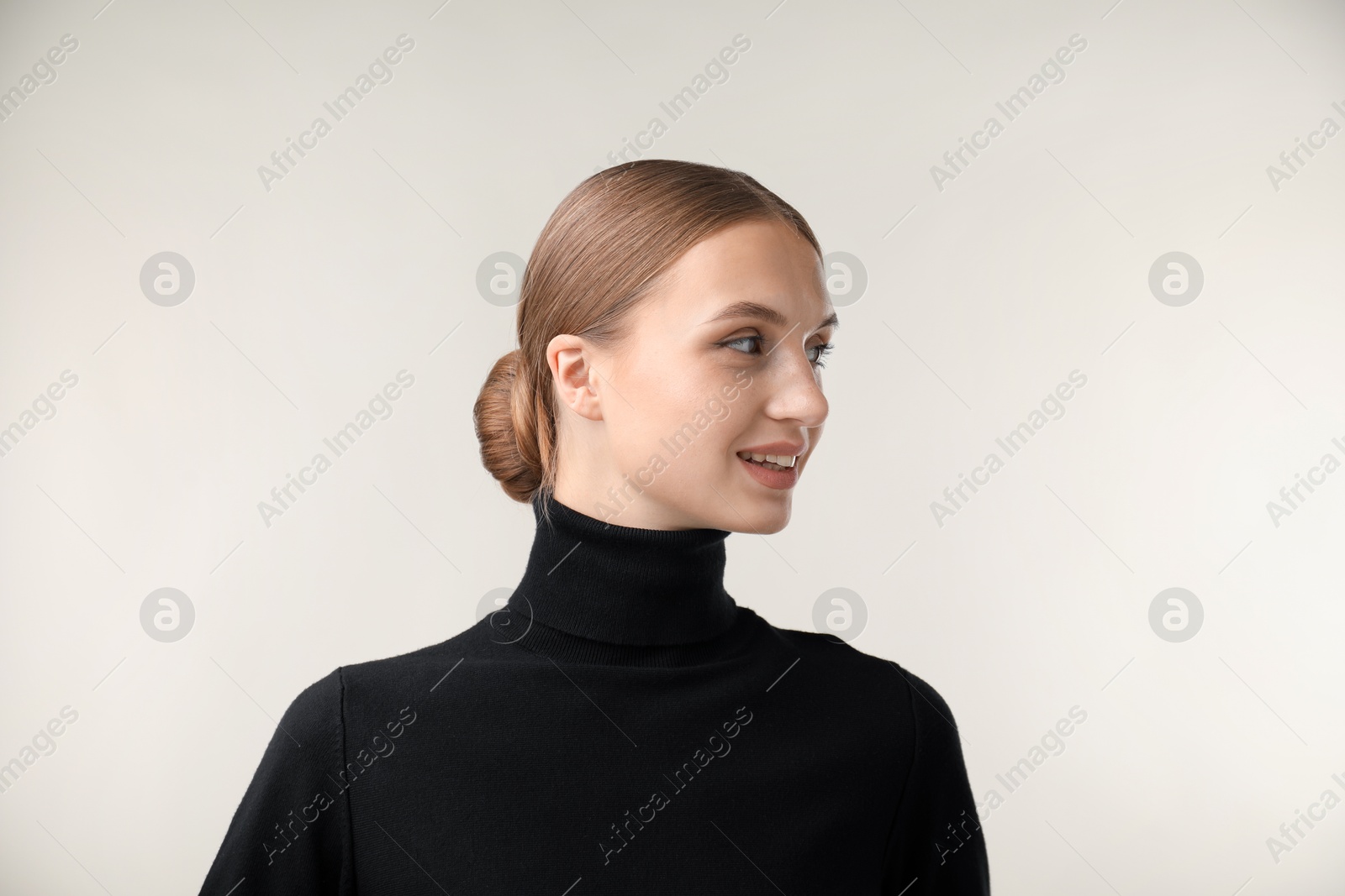 Photo of Portrait of beautiful woman on light background