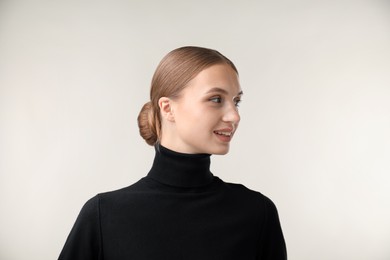 Photo of Portrait of beautiful woman on light background
