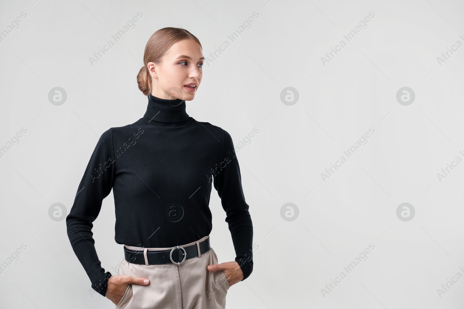 Photo of Portrait of beautiful woman on light background. Space for text