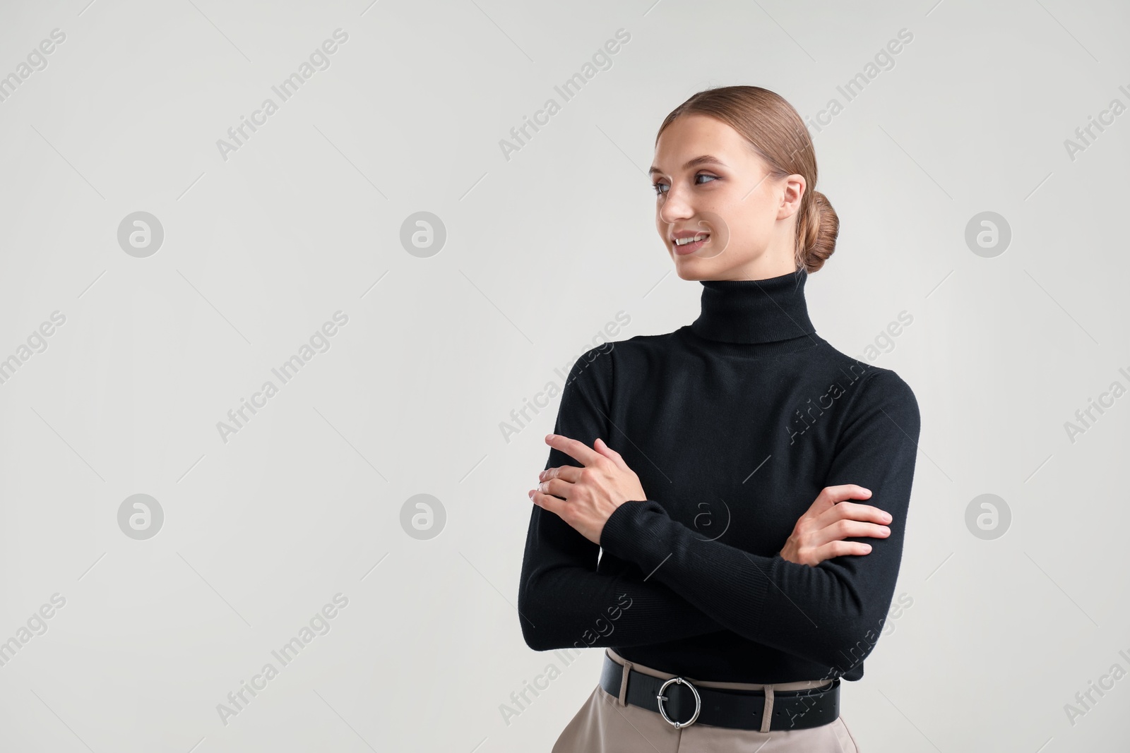 Photo of Portrait of beautiful woman on light background. Space for text