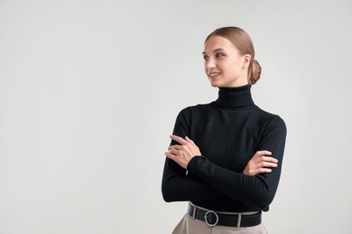 Photo of Portrait of beautiful woman on light background. Space for text
