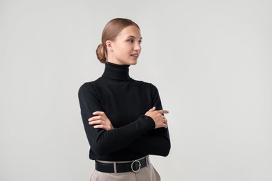Photo of Portrait of beautiful woman on light background