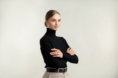 Photo of Portrait of beautiful woman on light background