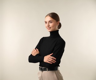 Photo of Portrait of beautiful woman on light background