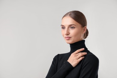 Photo of Portrait of beautiful woman on light background. Space for text