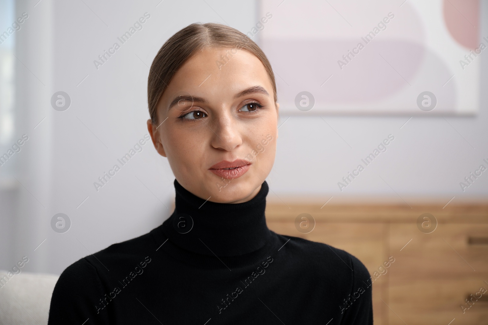 Photo of Portrait of positive elegant woman at home