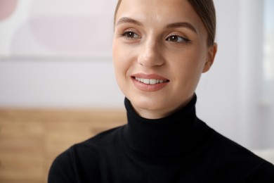 Photo of Portrait of positive elegant woman at home