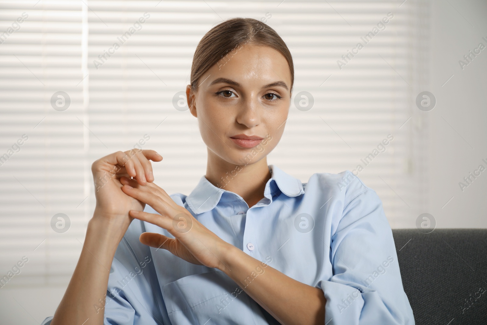 Photo of Portrait of beautiful young woman at home
