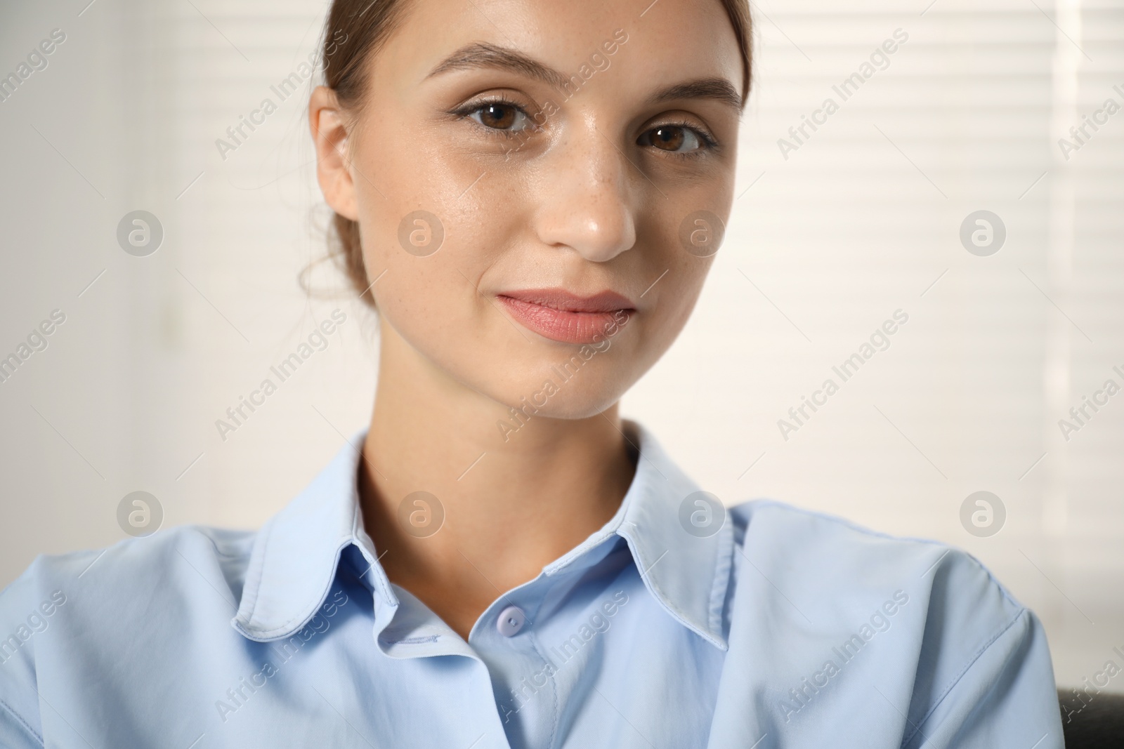 Photo of Portrait of beautiful young woman at home